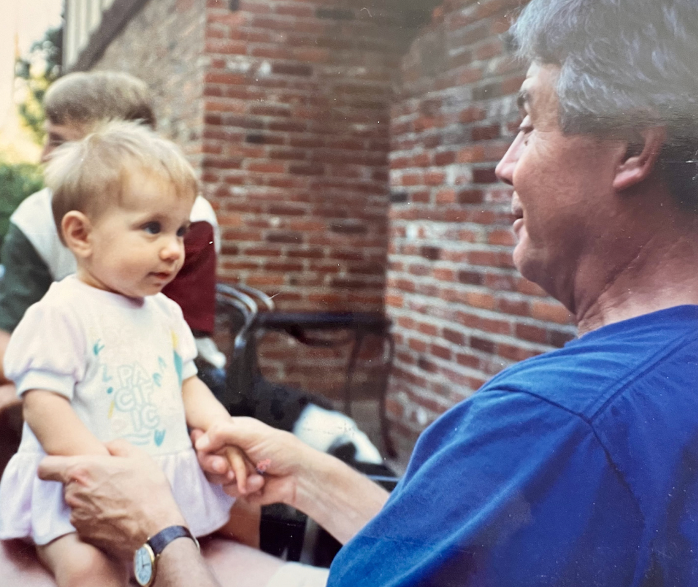 Baby looking up at her grandfather<br />
